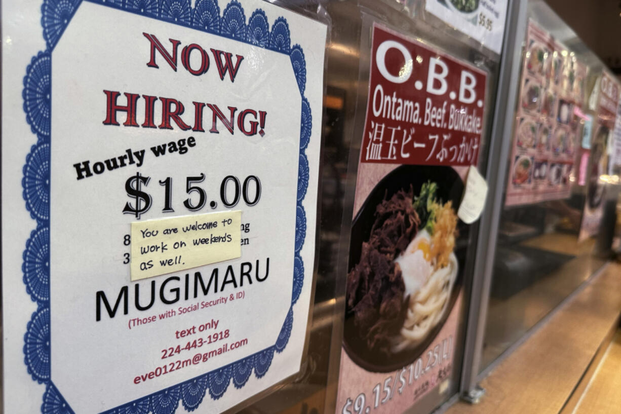 FILE - A hiring sign is displayed at a restaurant in Arlington Heights, Ill., June 28, 2024. (AP Photo/Nam Y.