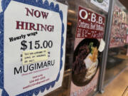 FILE - A hiring sign is displayed at a restaurant in Arlington Heights, Ill., June 28, 2024. (AP Photo/Nam Y.