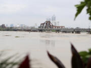 The iconic Long Bien bridge is seen on flooded Red river, following Typhoon Yagi in Hanoi, Vietnam on Tuesday, Sept. 10, 2024.