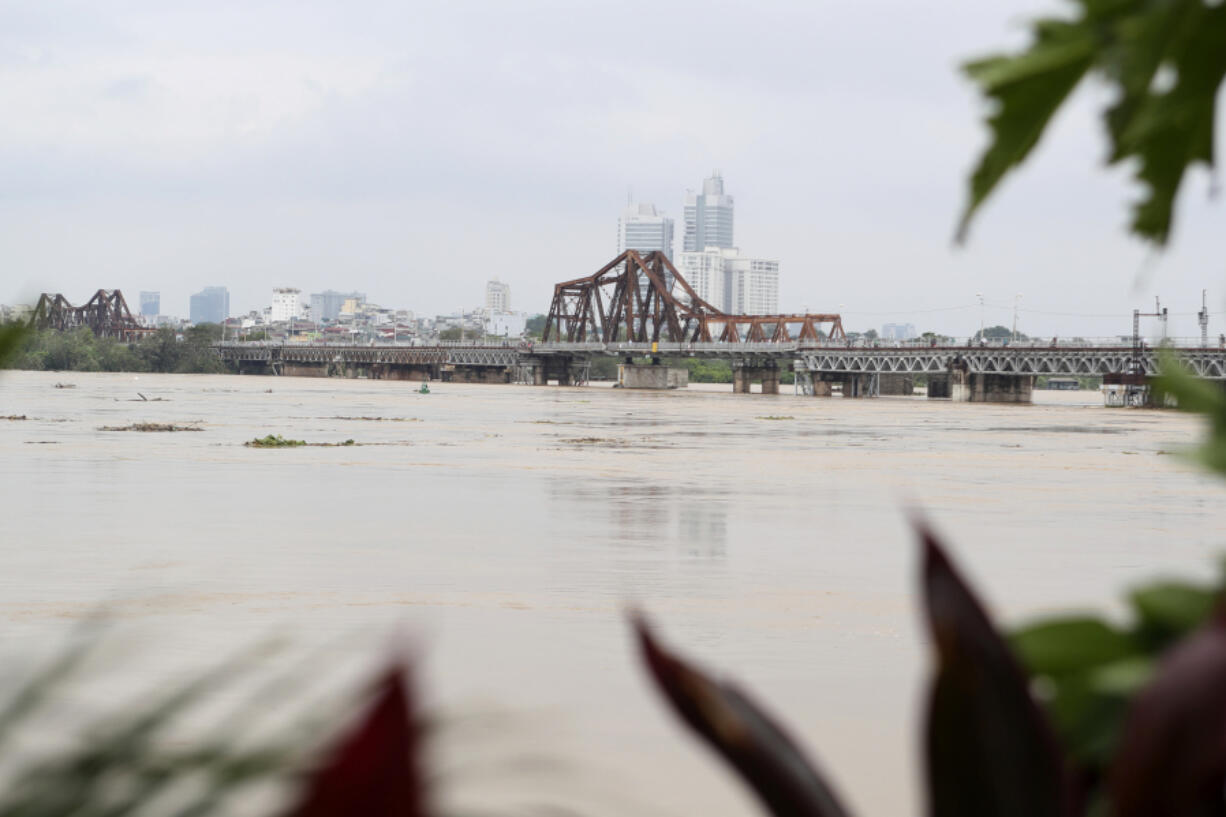 The iconic Long Bien bridge is seen on flooded Red river, following Typhoon Yagi in Hanoi, Vietnam on Tuesday, Sept. 10, 2024.