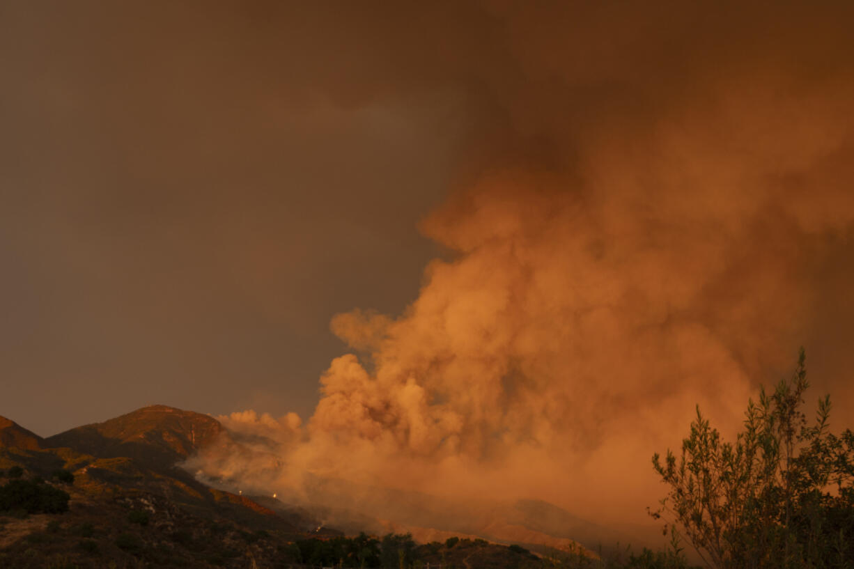 Smoke from the Airport Fire fills the skies Monday, Sept. 9, 2024, near Trabuco Canyon, Calif.