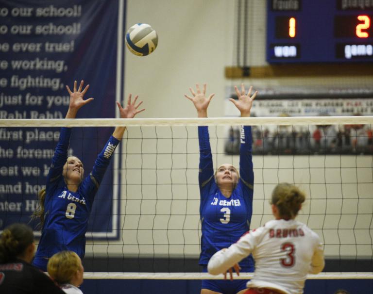 La Center's Aristyn Wiseman (8) and Paige Sherry (3) go up for a block during a 1A Trico League volleyball match Thursday, Sept. 19, 2024. La Center won, 3-0.