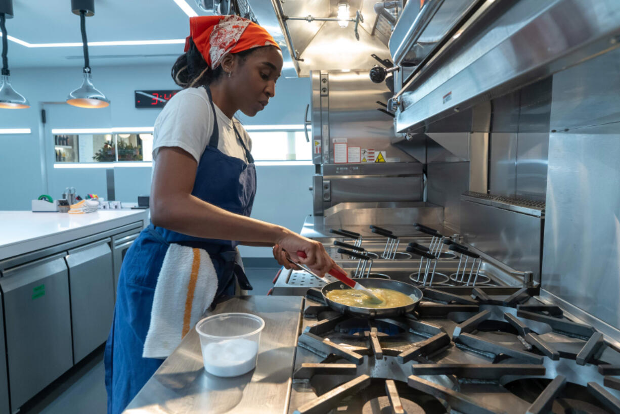 Ayo Edebiri whips up an omelet in season two of &ldquo;The Bear.&rdquo; (Chuck Hodes/FX)