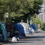 Tents line the side of the road along West 11th Street in downtown Vancouver in June. Council for the Homeless data shows the number of people experiencing homelessness in Clark County decreased for the first time in at least five years. (Amanda Cowan/The Columbian files)