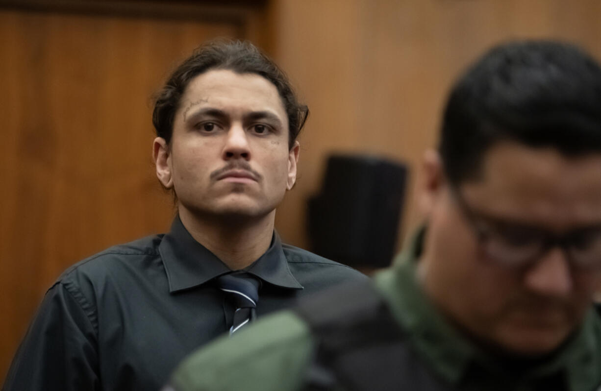 Defendant Austin Navarro enters the courtroom for opening statements in his murder trial July 10 at the Clark County Courthouse. A judge sentenced him Tuesday to 25 years in prison after a jury found him guilty of second-degree domestic violence murder.