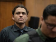 Defendant Austin Navarro enters the courtroom for opening statements in his murder trial July 10 at the Clark County Courthouse. A judge sentenced him Tuesday to 25 years in prison after a jury found him guilty of second-degree domestic violence murder.