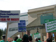 State employees gathered outside the Labor and Industries Building in Tumwater Sept. 10 as part of a statewide walkout to demand fair wages and safe staffing levels.