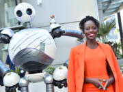 Lupita Nyong&rsquo;o poses with Roz the wild robot July 27 during San Diego Comic-Con International in San Diego.