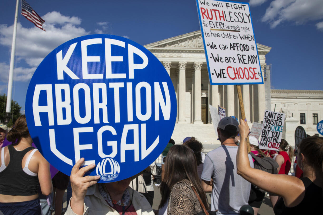 A person shows a sign while abortion rights activists protest in front of the U.S. Supreme Court in Washington, D.C., on June 24, 2024. The demonstration marked the second anniversary of the court&rsquo;s Dobbs v. Jackson Women&rsquo;s Health Organization ruling, which reversed federal protections for access to abortions.