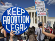 A person shows a sign while abortion rights activists protest in front of the U.S. Supreme Court in Washington, D.C., on June 24, 2024. The demonstration marked the second anniversary of the court&rsquo;s Dobbs v. Jackson Women&rsquo;s Health Organization ruling, which reversed federal protections for access to abortions.