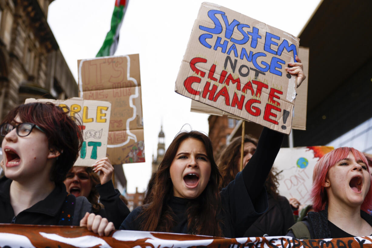 Climate protesters march through the city centre  on Oct. 28, 2022, in Glasgow, Scotland. The march was timed to mark the anniversary of the COP26 climate summit, held in Glasgow last year. The protesters called the COP a failure and accused the UK government of &ldquo;greenwashing&rdquo; links between fossil fuels and the current cost-of-living crisis.