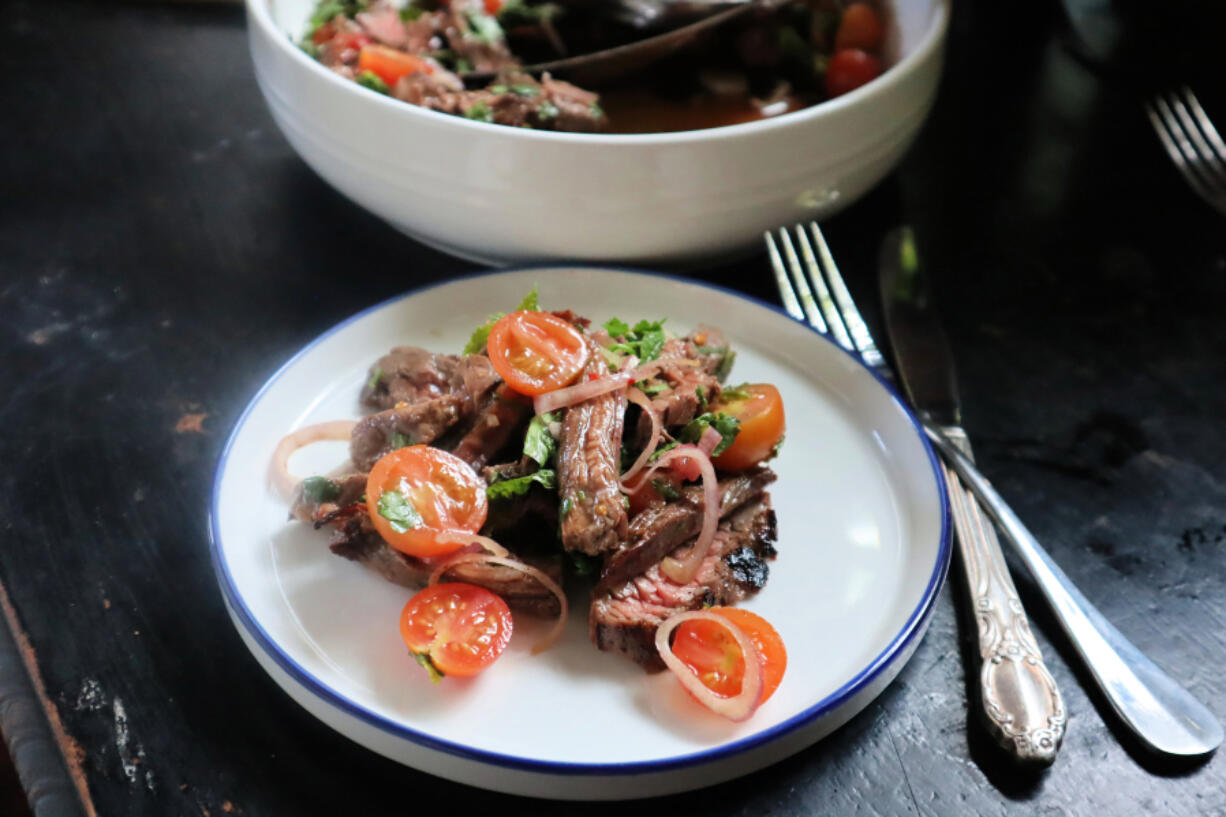 Made with budget-friendly skirt steak, Vietnamese beef salad is a great source of protein. A piquant lime-and-fish sauce dressing and shallots add tang.