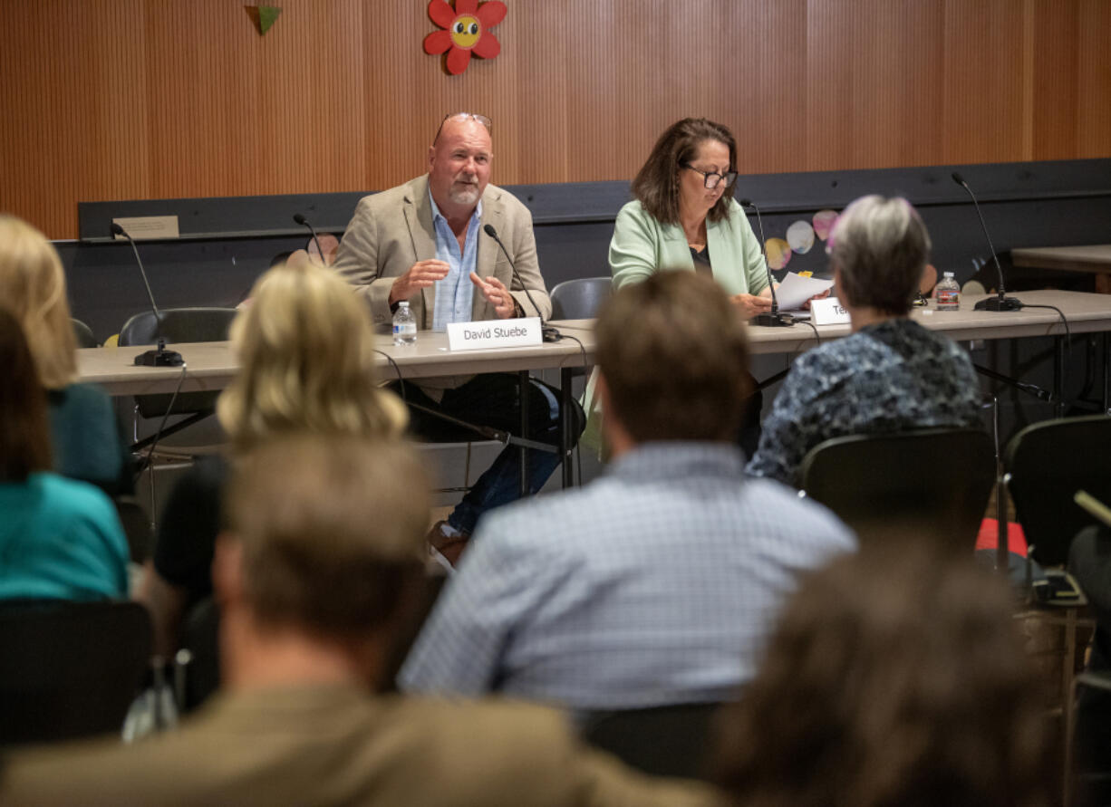 Republican David Stuebe, left, is running against Democrat Terri Niles, right, for the 17th Legislative District House Position 2 seat being vacated by Rep. Paul Harris, R-Vancouver. They speak during a June League of Women Voters candidate forum at the Vancouver Community Library.