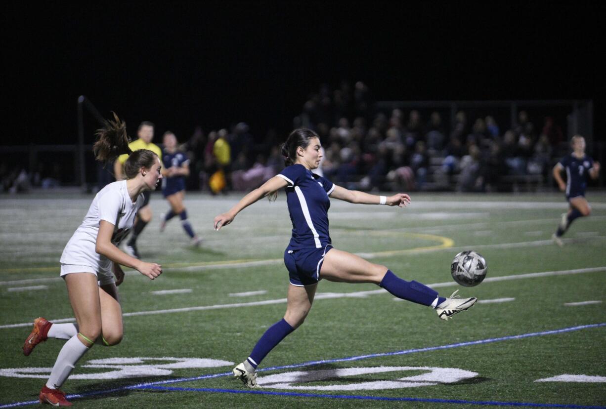 Skyview's Dea Covarrubias, center, flicks the ball forward in front of Camas defender Natalie Boyle, left, during a 4A Greater St. Helens League girls soccer game on Wednesday, Oct. 9, 2024, at Skyview High School.