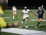 Camas' Kaliyah Salley (8) dribbles up the field against Skyview's Lauryn Cornelius (24) during a 4A GSHL girls soccer game on Wednesday, Oct. 9, 2024, at Skyview High School.