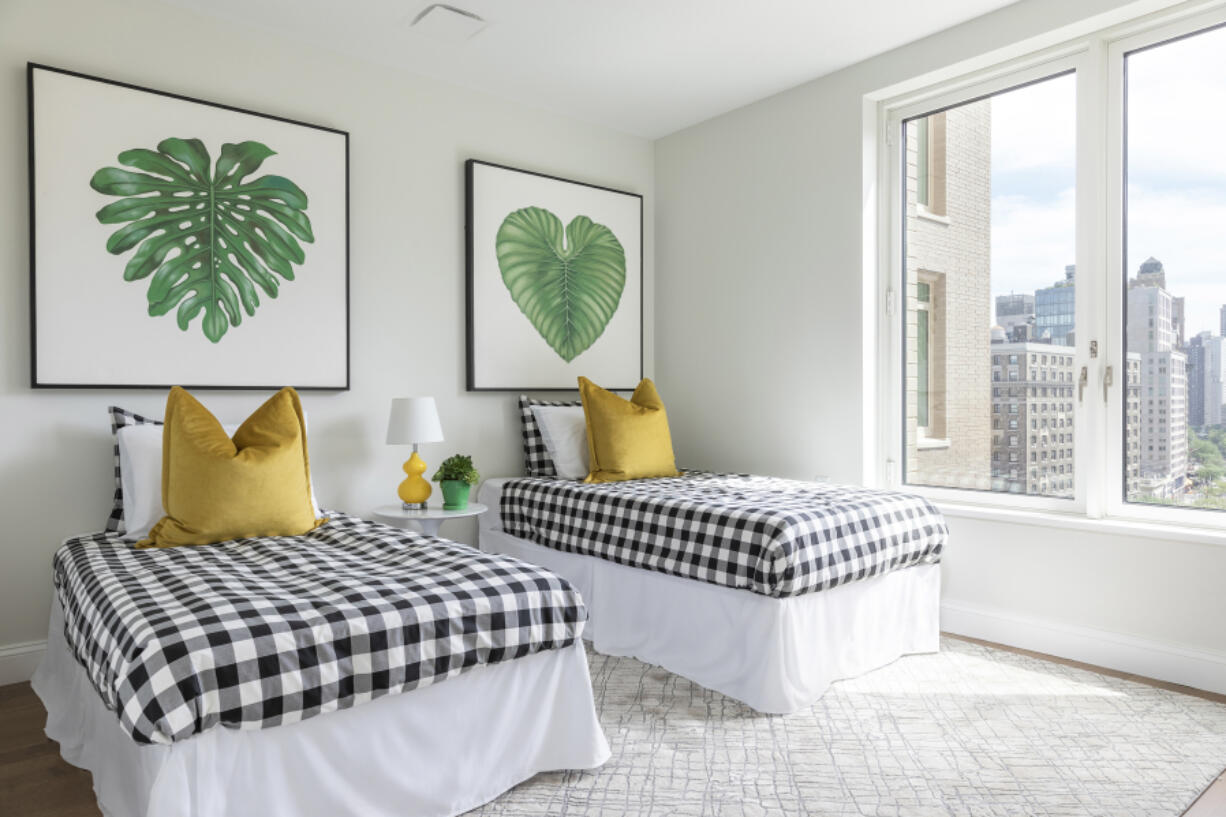 Oversized artwork is used instead of a traditional headboard.