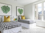 Oversized artwork is used instead of a traditional headboard.