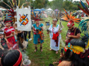 Members of Cetiliztli Nauhcampa stand in a circle together before taking part in a Four Directions Ceremony at the first Annual Indigenous Peoples&#039; Day Ceremonial Celebration in Newton, Massachusetts on Oct. 11, 2021.