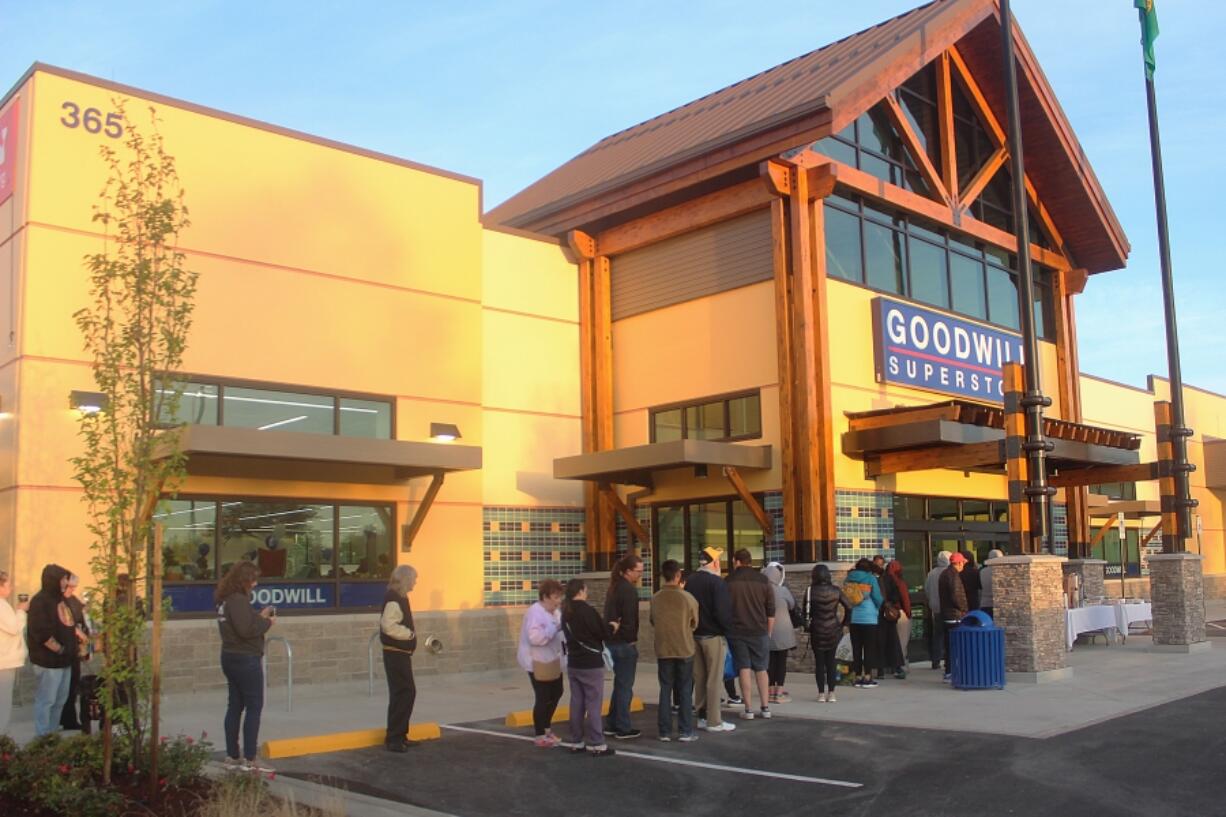 People stand in line before the opening of the new Goodwill superstore in Washougal on Oct. 3.