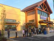 People stand in line before the opening of the new Goodwill superstore in Washougal on Oct. 3.