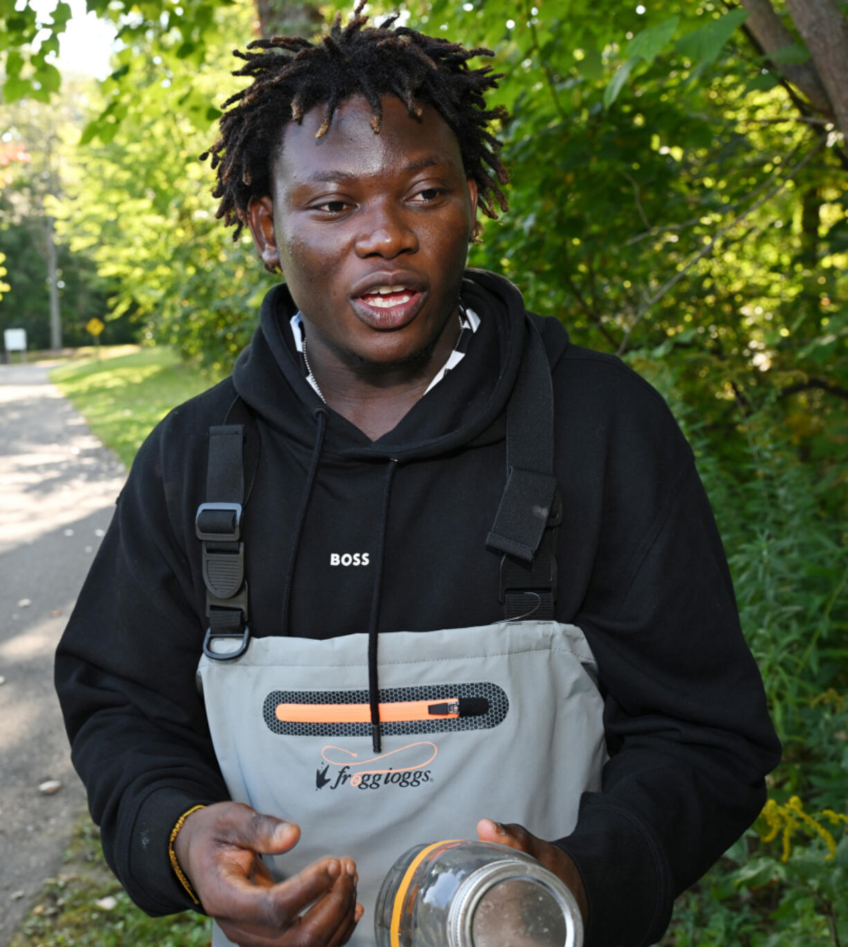 Muritadah Oshinuga, 28, master&Ccedil;&fnof;&Ugrave;s student in Environmental Sciences at WSU, talks about his study testing plastics and its effect on micro-plastics in Huron River on Sept. 18, 2024, in Dexter, Michigan.