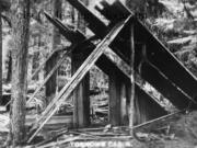 A postcard captioned, &ldquo;Tornows Cabin&rdquo; shows the makeshift lean-to in which he was purported to live while he was a fugitive. The &ldquo;cabin&rdquo; is nothing more than salvaged boards propped up against splits of wood and standing trees.