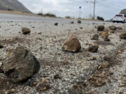 Grapefruit-sized rocks are strewn across the shoulder of Kanan Dume Road in Malibu, Calif., on Sept. 12 following a magnitude-4.7 earthquake centered in the area.