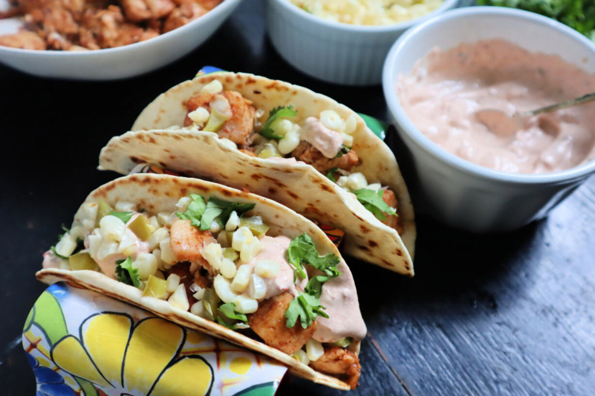 These spiced, fried tilapia tacos get an extra kick from chipotle crema and a fresh corn salsa studded with jalapeno.