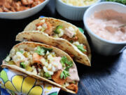 These spiced, fried tilapia tacos get an extra kick from chipotle crema and a fresh corn salsa studded with jalapeno.