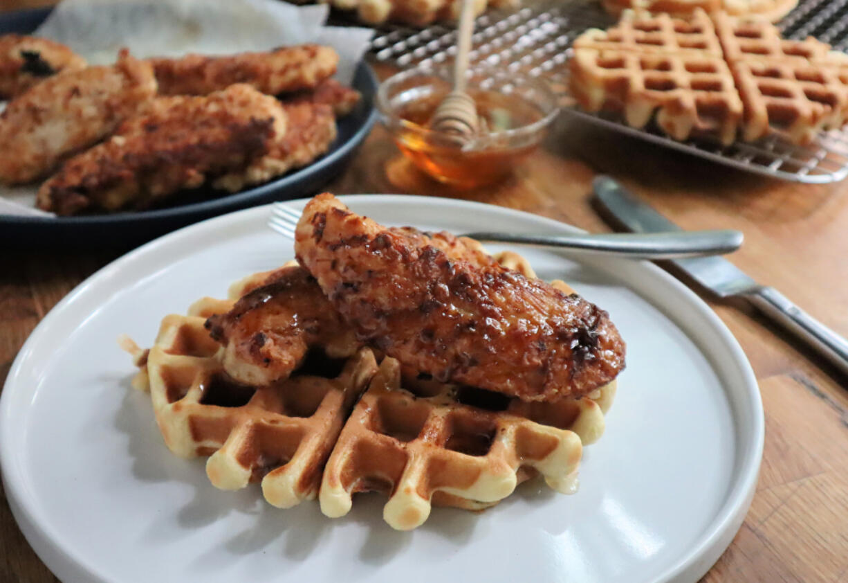 Chicken tenders drizzled with hot, sticky-sweet honey are a traditional way to top waffles.