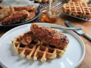 Chicken tenders drizzled with hot, sticky-sweet honey are a traditional way to top waffles.