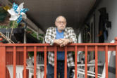 Lewis Record stands on his porch at his mobile home in Fruit Valley. Record is against adding more housing to Fruit Valley until the city does something to improve the neighborhood’s air quality.