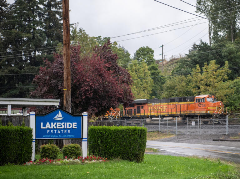 A train passes the Lakeside Estates mobile home park in Fruit Valley.