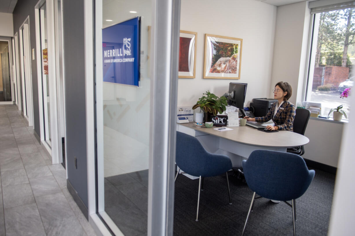 Eva Mao, a Merrill financial solutions advisor, works on accounts at Bank of America&rsquo;s Southeast 192nd Avenue branch. Wages have continued to grow in Clark County over the years. In 2022, the most recent state data available, Clark County residents made about $60,000, nearly $29 an hour.