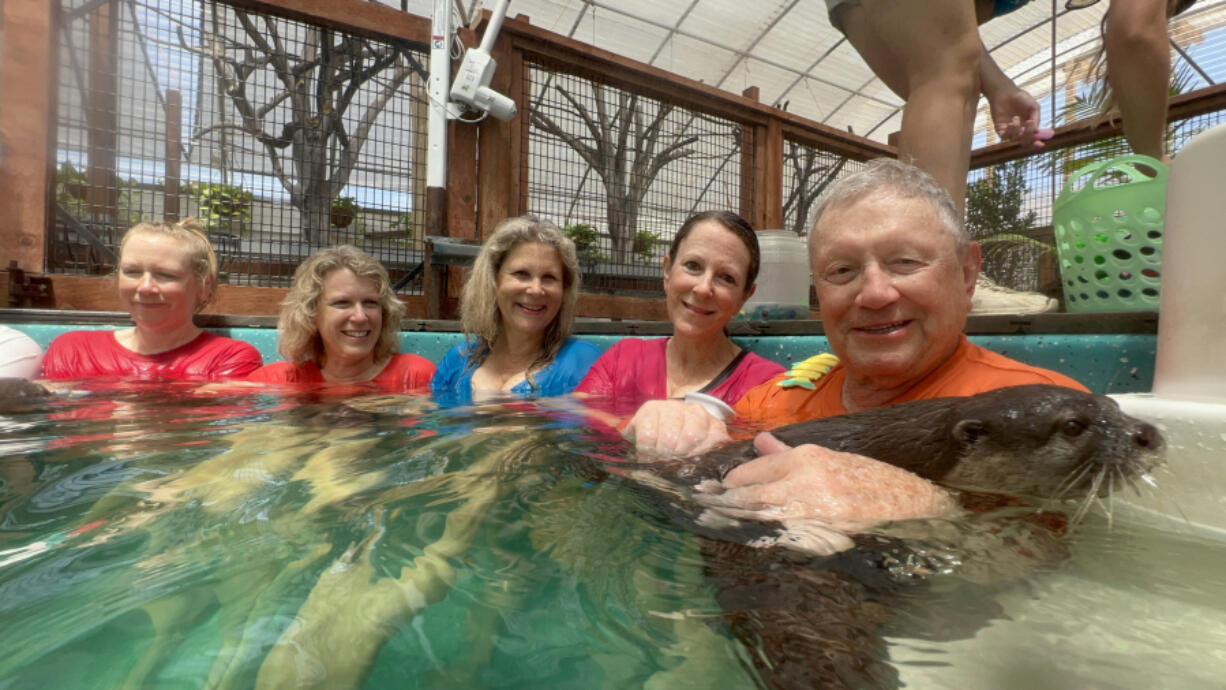 Courtesy Amy Swingen
At the Nurtured by Nature &ldquo;ottertarium&rdquo; are four Swingen sisters - Diane, left, Laura, Amy and Cindi - and Ron Swingen, their father.