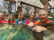 Courtesy Amy Swingen
At the Nurtured by Nature &ldquo;ottertarium&rdquo; are four Swingen sisters - Diane, left, Laura, Amy and Cindi - and Ron Swingen, their father.