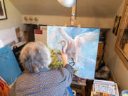 Vancouver artist Bev Jozwiak works on an acrylic painting Friday at her home.