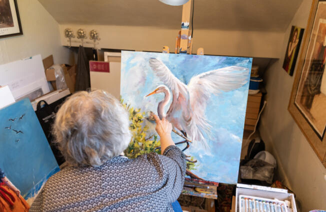 Vancouver artist Bev Jozwiak works on an acrylic painting Friday at her home.