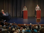 U.S. Rep. Marie Gluesenkamp Perez, left, takes center stage with challenger Joe Kent during a contentious debate at Lower Columbia College on Wednesday evening, Oct. 2, 2024.