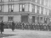 U.S. troops, possibly part of the 14th Infantry from Vancouver Barracks under command of Brig. Gen. John Gibbon, lined up in front of a downtown Seattle hotel during the anti-Chinese mob violence in February 1886.