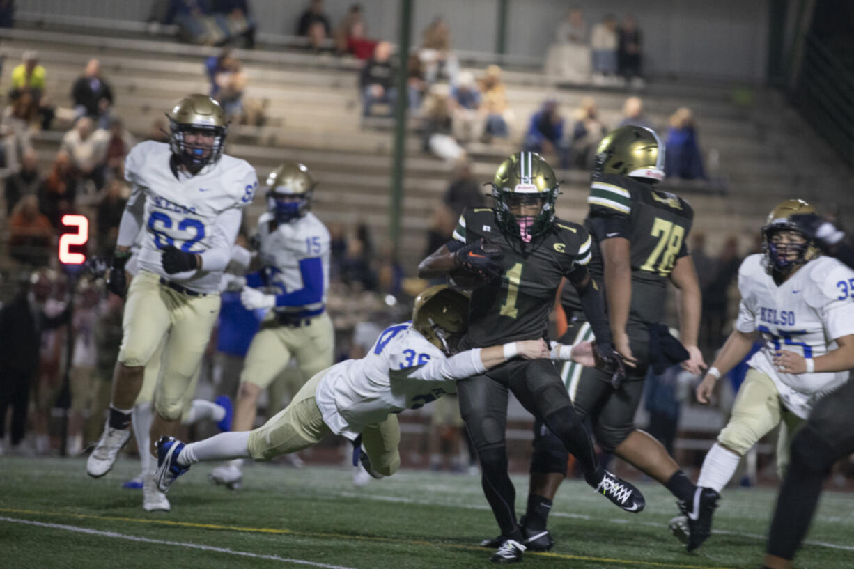 Evergreen&rsquo;s Terrance Saryon (1) tries to evade a tackle on Friday during Evergreen&rsquo;s 42-35 win against Kelso at McKenzie Stadium.