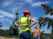 U.S. Rep. Marie Gluesenkamp Perez listens as Jon Cole of Green Diamond speaks to the group during a Skamania County forest tour in Underwood on Friday afternoon, Aug. 16, 2024. The Congresswoman previously introduced the bipartisan Treating Tribes and Counties as Good Neighbors Act as well as the bipartisan Jobs in the Woods Act.