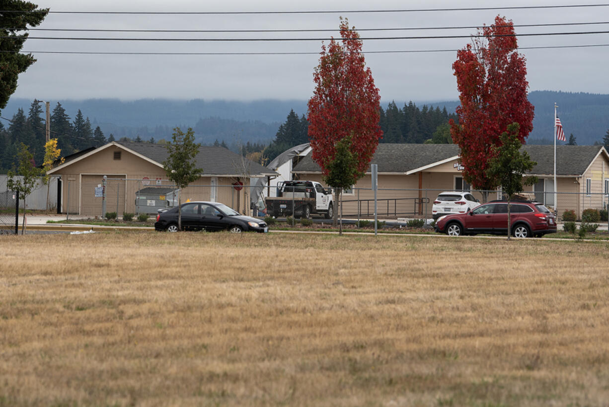 A motorist passes by vacant lots off state Highway 503 where developers have proposed a 13-building industrial development.