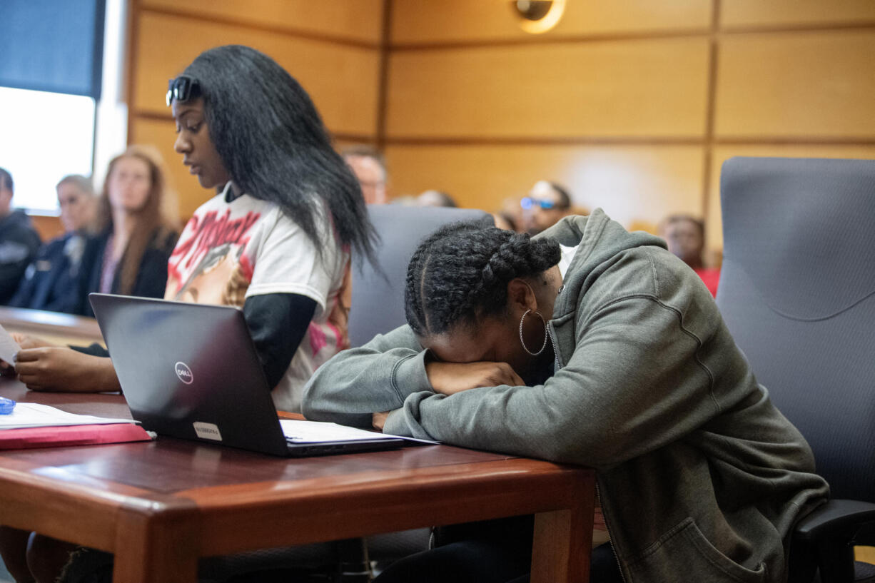 Lashay Gates, left, aunt of Layla Stewart, reads a victim impact statement as she joins her mom, Kristie Mays, grandmother of Layla Stewart, while Kirkland Warren is sentenced to life in prison for her death and the the deaths of her mom, Meshay Melendez, at the Clark County Courthouse on Tuesday afternoon, Oct. 8, 2024.