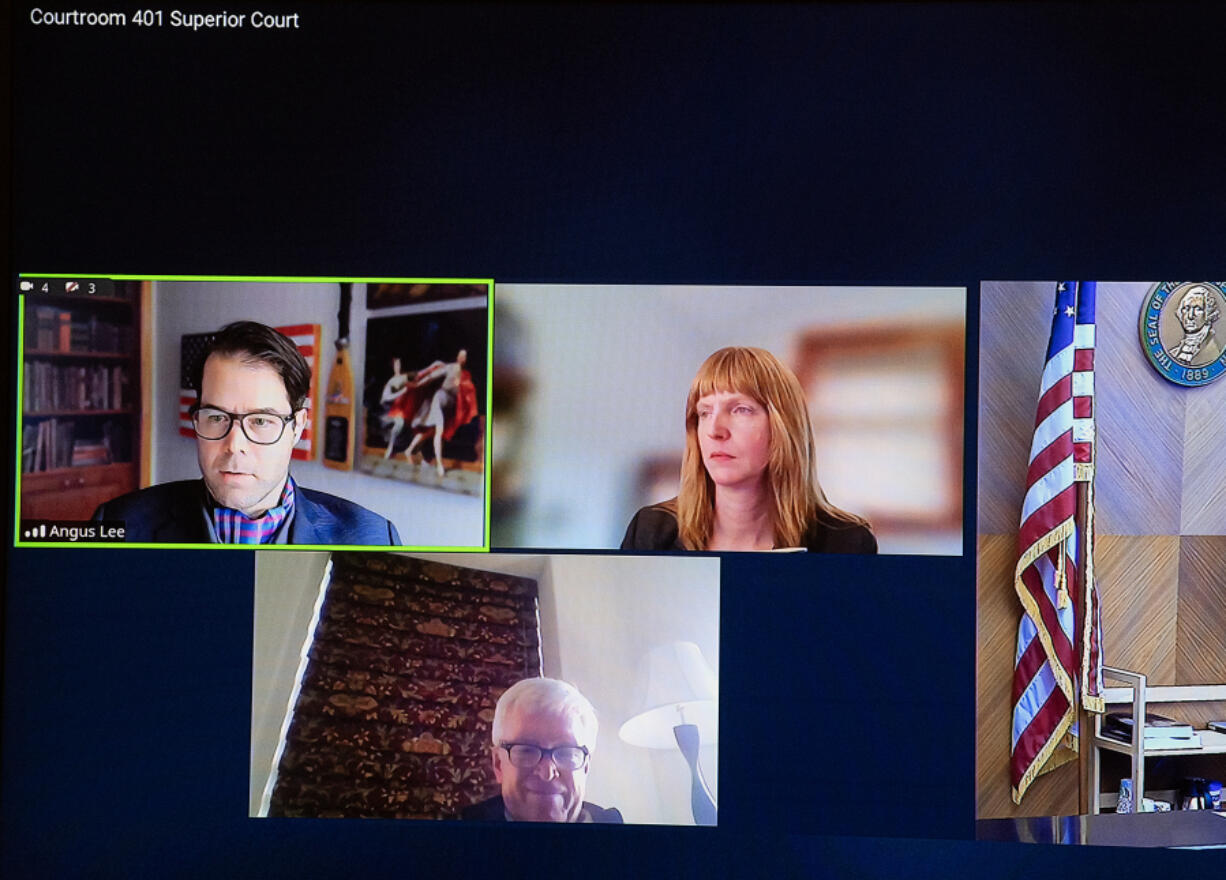 Attorneys Angus Lee, clockwise from top left, and Amanda Migchelbrink join John Ley as they appear remotely at the Clark County Courthouse on Friday afternoon. Ley made an appearance during a hearing for voter fraud charges.