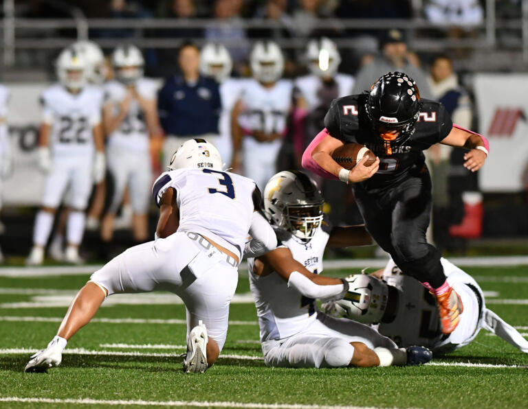 Kalama senior Drew Schlangen (2) runs the ball Friday, Oct. 11, 2024, during Kalama’s 49-12 loss to Seton at Kalama High School.