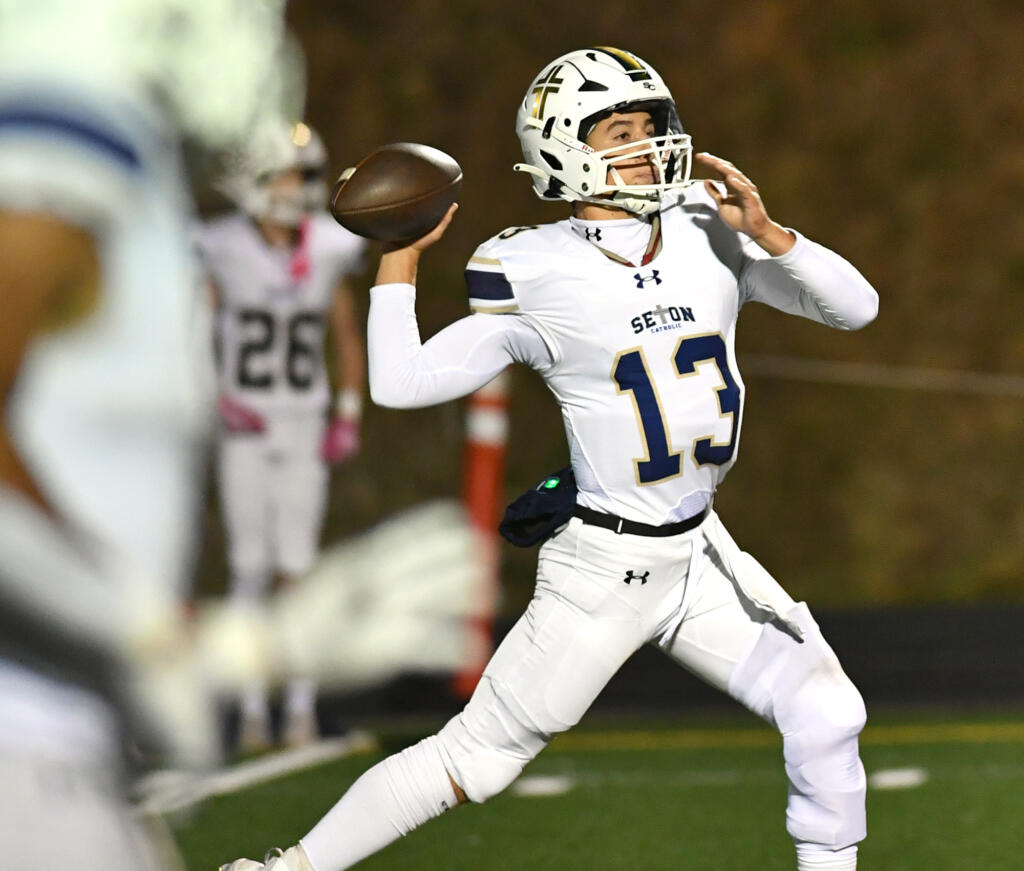 Seton Catholic junior Kolten Gesser throws the ball Friday, Oct. 11, 2024, during the Cougars’ 49-12 win against Kalama at Kalama High School.