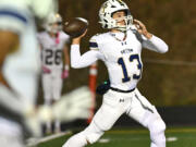 Seton Catholic junior Kolten Gesser throws the ball Friday, Oct. 11, 2024, during the Cougars’ 49-12 win against Kalama at Kalama High School.