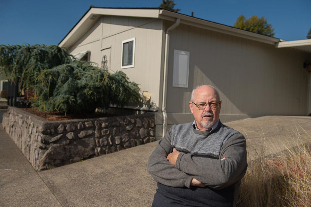 Rick Seekins, a homeowner at the Vista Del Rio mobile home park, walks outside his home, which cannot be moved if the park is sold for development. The city of Vancouver is considering a mobile home overlay zone that would prevent manufactured home parks from being sold and turned into commercial buildings or other forms of housing.