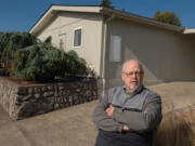 Rick Seekins, a homeowner at the Vista Del Rio mobile home park, walks outside his home, which cannot be moved if the park is sold for development. The city of Vancouver is considering a mobile home overlay zone that would prevent manufactured home parks from being sold and turned into commercial buildings or other forms of housing.